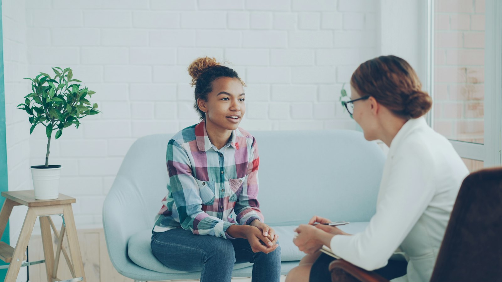 Two people talking in a calm office setting